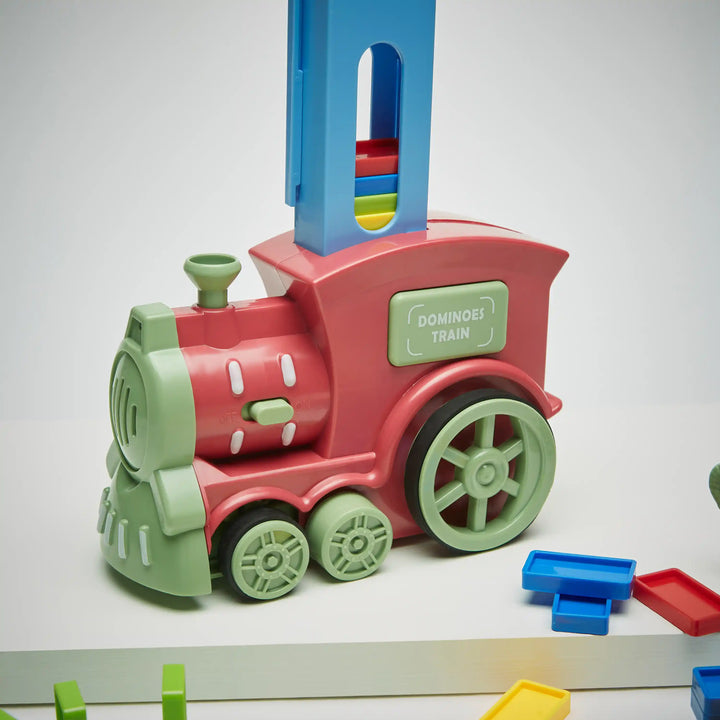 Automatic domino laying toy with domino cartridge attachment