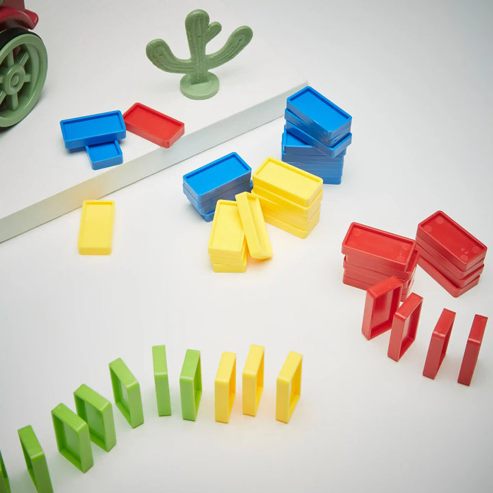 Close-up of domino train loading cartridge and dominos available at giggle nest